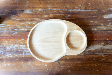 food plate and cup of coffee on wooden table
