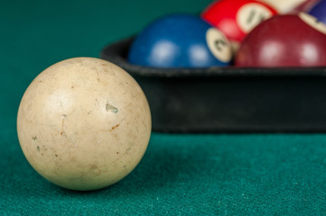 Billiards balls and cue on billiards table. Billiard sport concept