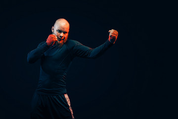 Sportsman boxer fighting on black background, Boxing sport concept.