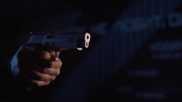 Stock video footage firearm firing of a gun in the dash