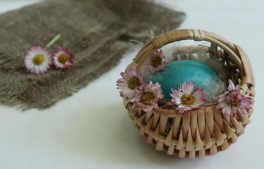 Fototapeta na wymiar Easter basket on the background of a linen napkin