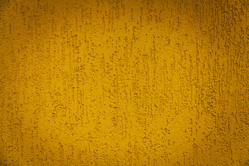 Yellow decorative stucco texture on the wall