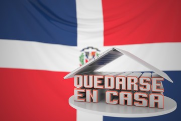 QUEDARSE EN CASA or STAY HOME text in Spanish under open laptop against the Dominican flag. Coronavirus self-isolation in the Dominican republic 3D rendering