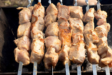 Delicious pork meat roasts on coal