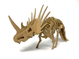 3d cardboard dinosaur puzzle on a white background. children's designer from cardboard. 3D volume...