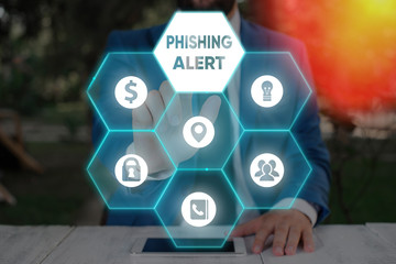 Writing note showing Phishing Alert. Business concept for aware to fraudulent attempt to obtain...