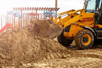 Fototapeta premium Excavator. Digger machine digging earth in construction site