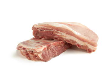 fresh raw pork ribs isolated on a white background. two pieces. ingredient for meat cuisine. side view