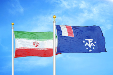 Iran and French Southern and Antarctic Lands two flags on flagpoles and blue sky