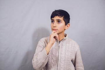 cute boy thinks