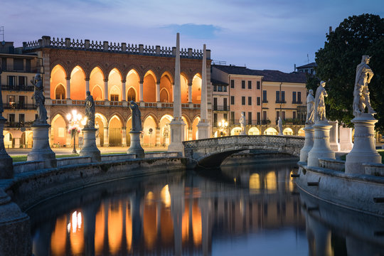 Prato della Valle square in Padua (Padua). View of the canal with statues, in the background the Loggia Amulea a typical Venetian neo-Gothic palace, Veneto, Italy