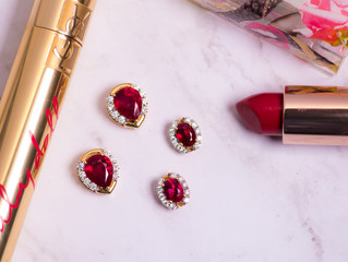 Ruby jewelry with makeup items