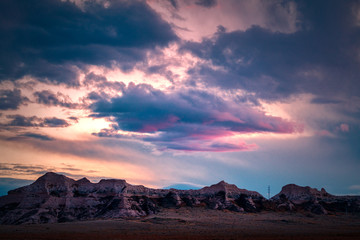 Fototapeta na wymiar Fantastic sunset clouds over mountain silhouette