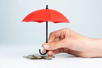 Hand hold a red umbrella 3D icon isolated on black background