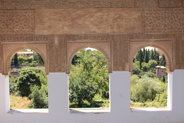 Historical wall carvings inside Generalife Palace at Alhambra palace and fortress complex in Granada, Andalusia, Spain.