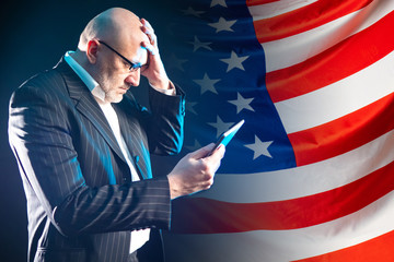 Adverse financial information from the United States. A man clutched his head against the...