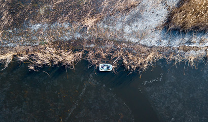 the top view of the fisher on iced lake