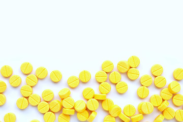 Tablets of Paracetamol on yellow background.