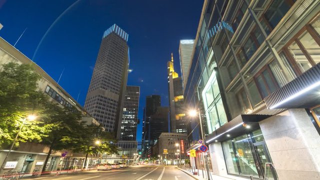 Frankfurt at night skyscrapers business district view, traffic at night time lapse hyperlapse video. Frankfurt skyline, modern office towers and European Central Bank in Frankfurt.