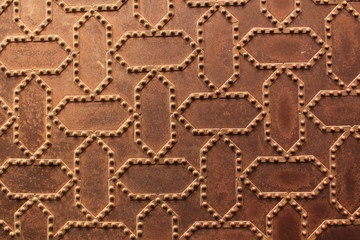 Metal door pattern of Nasrid Palaces (Palacios Nazaries) at the historical Alhambra Palace complex in Granada, Andalusia, Spain.