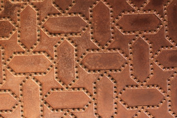 Metal door pattern of Nasrid Palaces (Palacios Nazaries) at the historical Alhambra Palace complex in Granada, Andalusia, Spain.