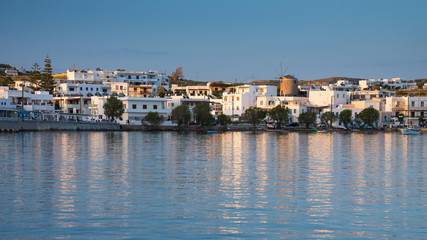 Fototapeta na wymiar panoramic view to greek city on the Mylos island with view to old wind mill