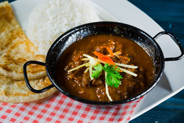 Oriental food - Indian takeaway at a London's market.