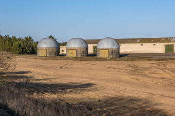 Fototapeta premium agro-processing and manufacturing plant for processing and silver silos for drying cleaning and storage of agricultural products, flour, cereals and grain. Granary elevator.