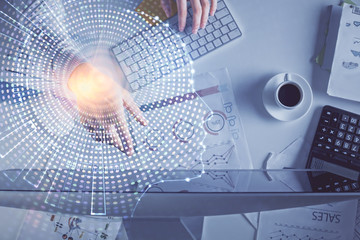 Double exposure of man's hands typing over computer keyboard and brain hologram drawing. Top view. Ai and data technology concept.