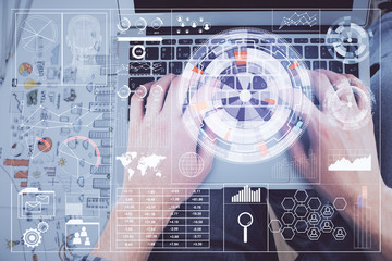 Multi exposure of man's hands typing over computer keyboard and data theme hologram drawing. Top view. Technology concept.