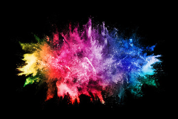 abstract colored dust explosion on a black background.abstract powder splatted background,Freeze motion of color powder exploding/throwing color powder, multicolored glitter texture.