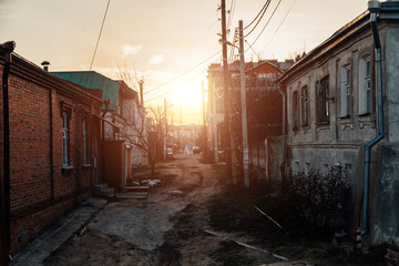 Fototapeta Old houses on low-rise street in old poverty part of Voronezh city in Russia in sunset obraz