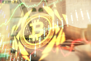 Double exposure of woman hands typing on computer and crypto market theme hologram drawing....