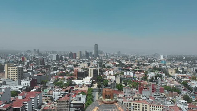 Aerial shot of the Monument to the revolution, the Plaza de la Revolución and Mexico City in the background. During the covid-19 pandemic contingency in March 2020