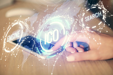 Double exposure of blockchain business sketch hologram and woman holding and using a mobile device.