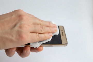 Phone disinfection during quarantine. Prevent covid-19 distribution, sanitize your gadgets