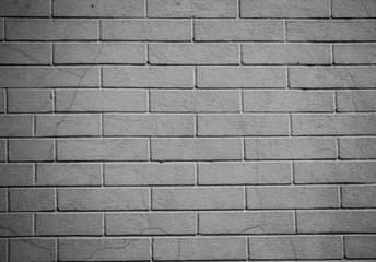 cement wall on which bricks are painted