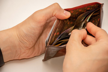 Hands holding wallet with australian dollars - low income due to coronavirus