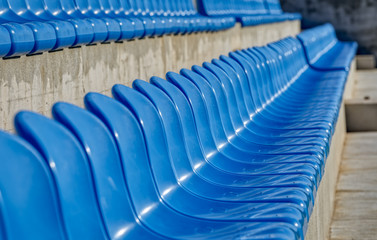 Fototapeta premium Blue Chairs At The Stadium