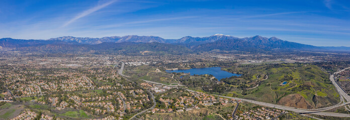 Aerial view of Puddingstone Reservoir with Mt. Baldy as background