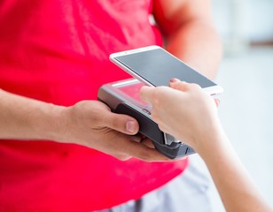 Concept of paying with POS terminal