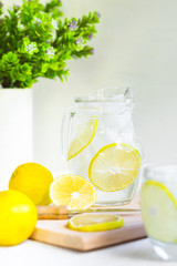 Fresh Sweet Lemonade Water; knife, wood and some plants