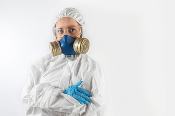 Isolated young woman in respirator and medical uniform. Healthcare, medical and covid-19 concept.