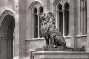 Black-and-white image of a sculpture of a proud and haughty lion