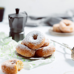 Donuts with sugar powder on the white background