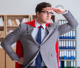 Superhero businessman working in the office