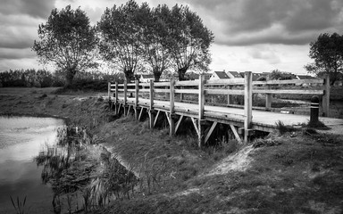 old wooden bridge over dry river