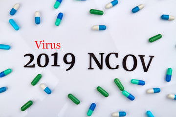 CORONAVIRUS 2019-nCoV concept. A bunch of pills islated on white background.