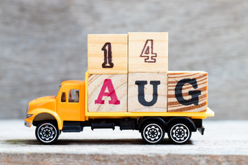 Truck hold letter block in word 14aug on wood background (Concept for date 14 month August)