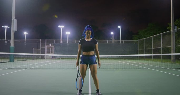 Tennis player girl looking in camera